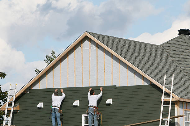 Professional Storm Damage Siding Repair technician working in Selma, NC
